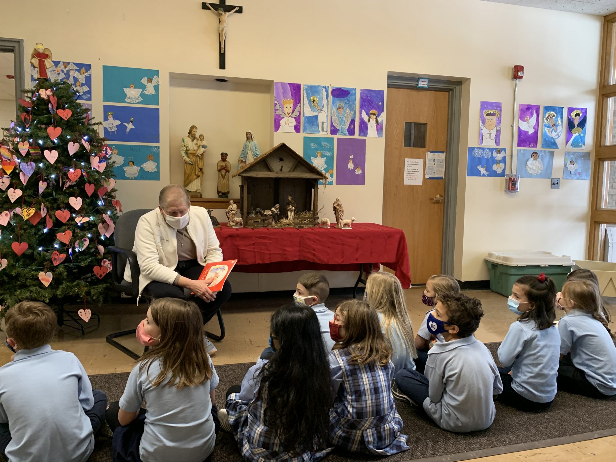 Sr. Karen reads the Nativity Story to 1st grade